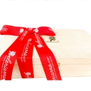 Premium wooden gift box with white wine, engraved bottle, glass, and chocolate